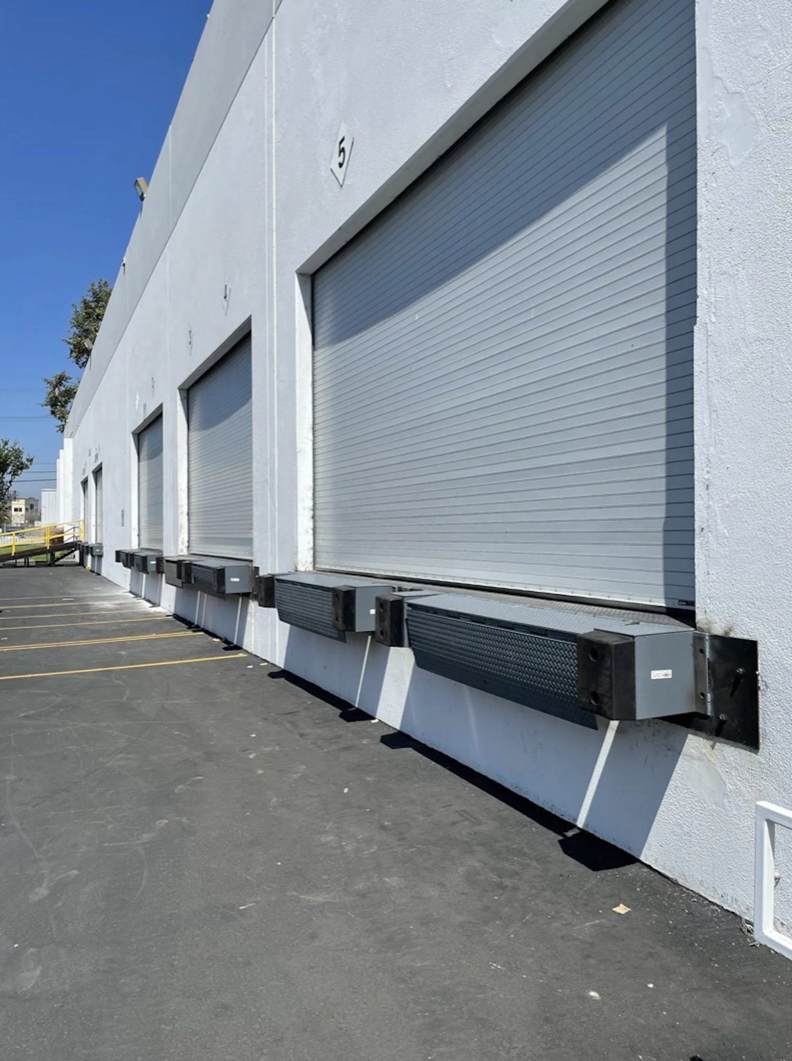 Guide to Understanding Dock-High vs. Grade Level Doors