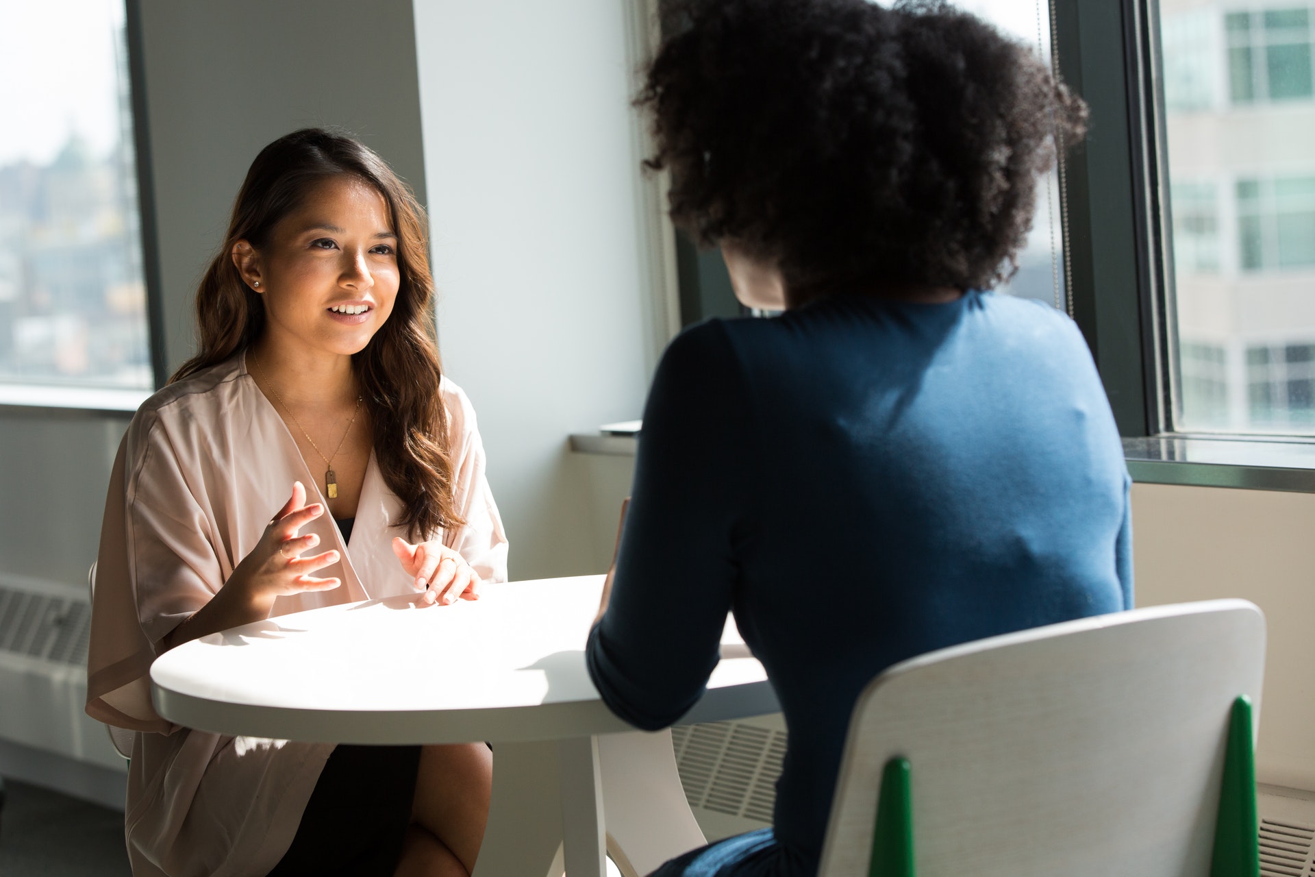 two women discussing business