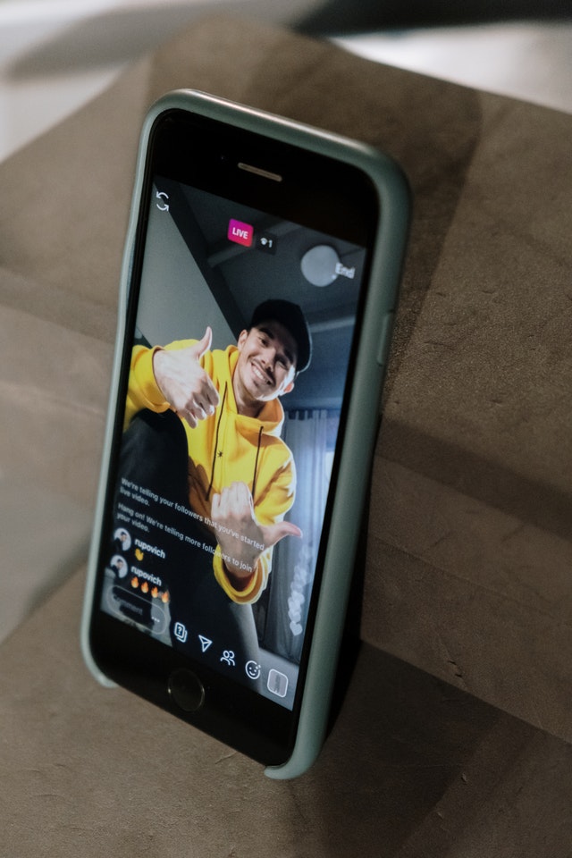  boy doing instagram live with yellow shirt