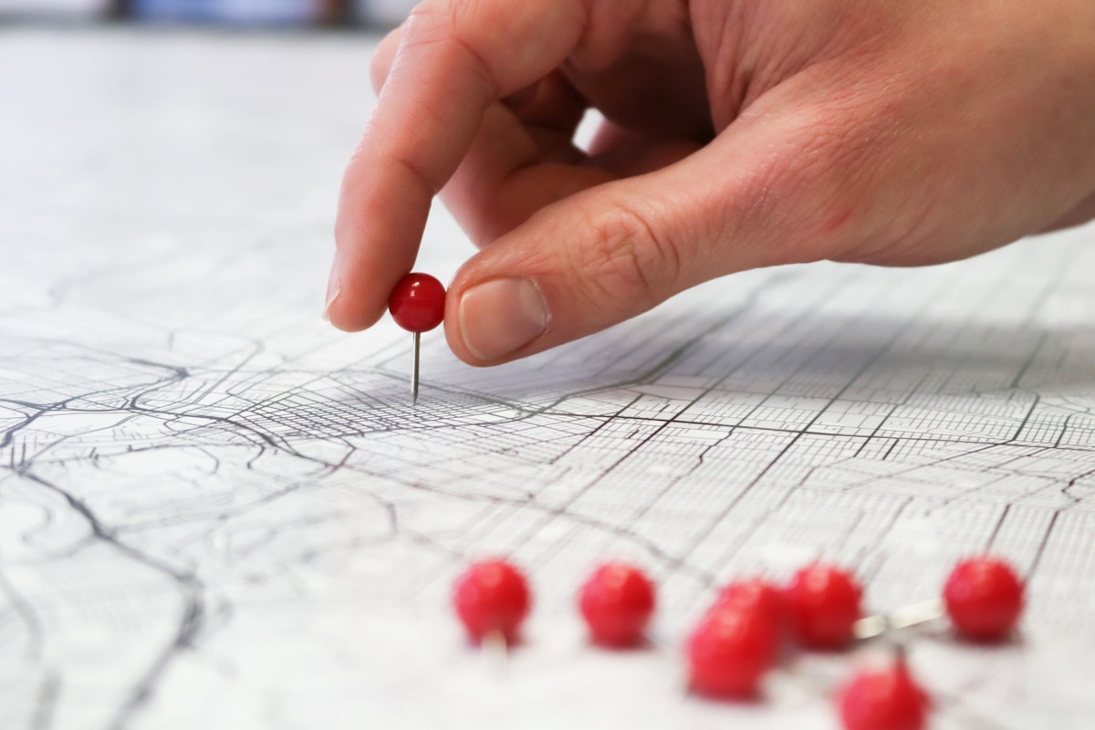 Digital logistics network showing warehouses, transportation routes, geographic coordinates, and real-time location data across a modern supply chain.