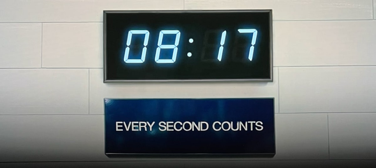 Digital clock displaying 08:17 with "Every Second Counts" sign - productivity in construction and manufacturing
