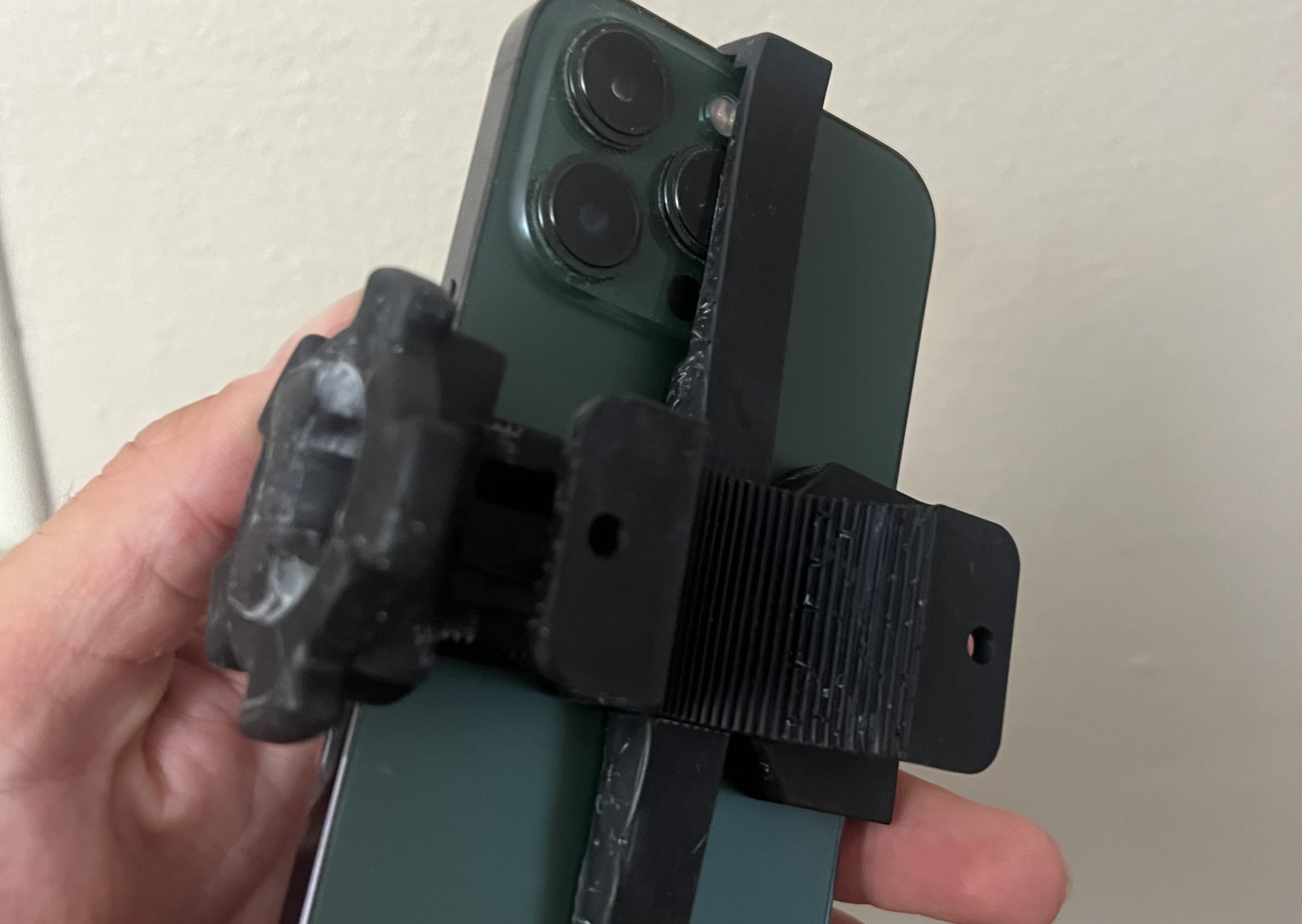 Early 3D printed prototype of phone mounting system for paddles used in hand washes