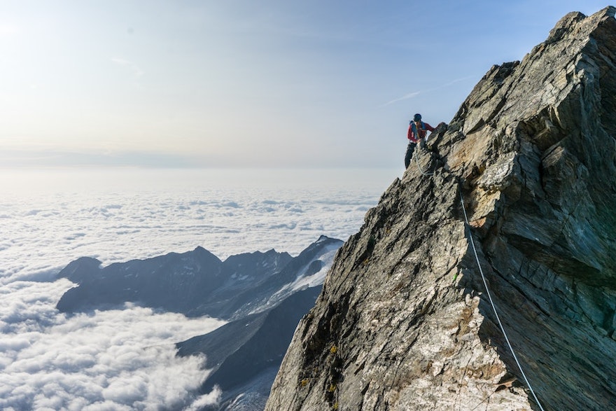 A man climbing a steep mountain
