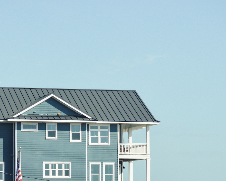 a blue house infront of a blue sky 