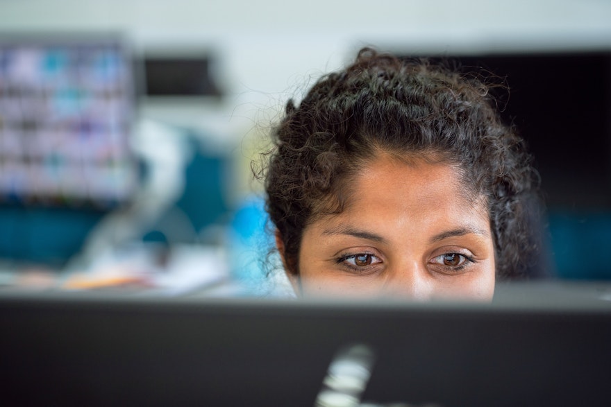 woman working at computer smiling