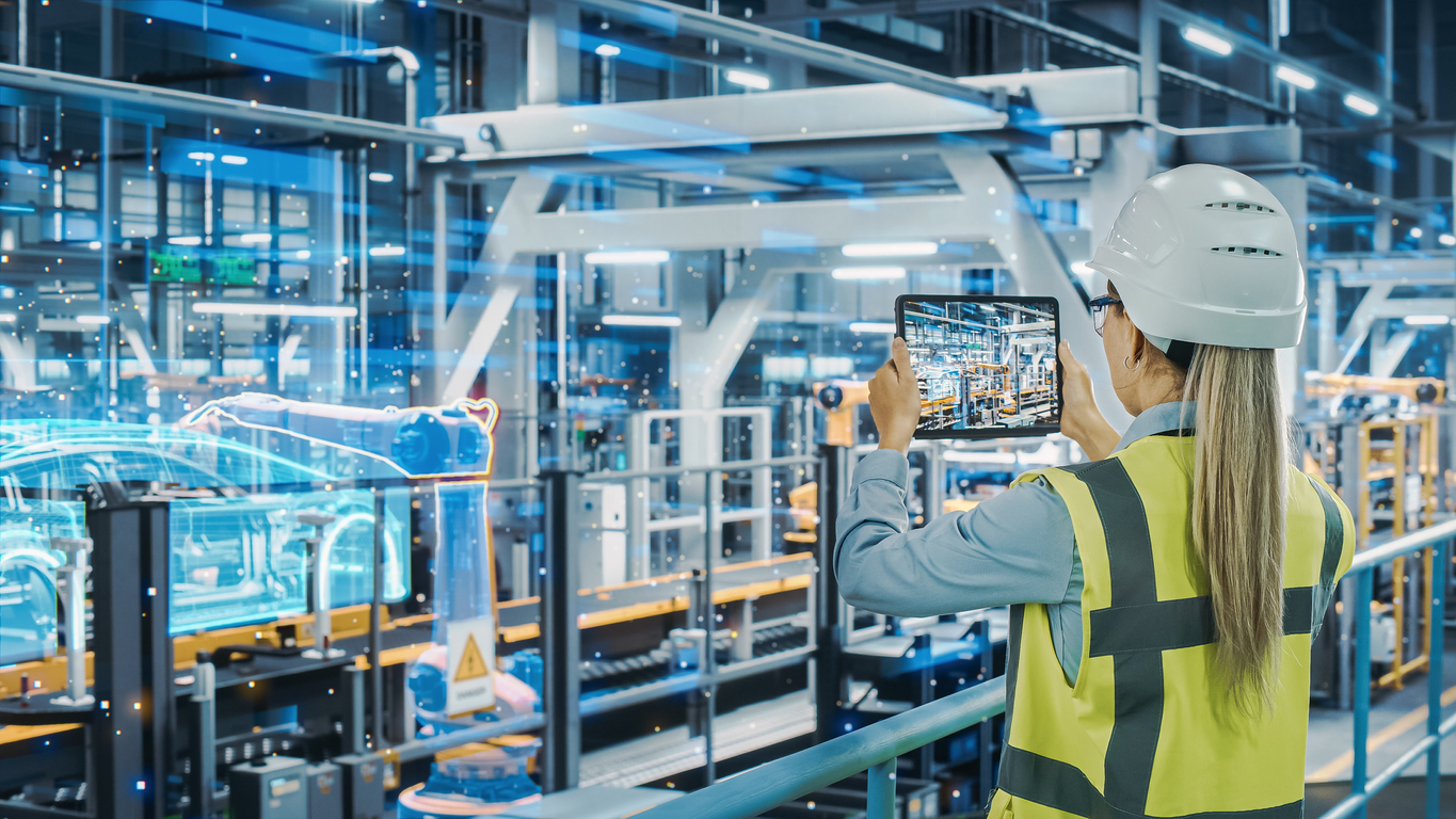 woman in factory looking at tablet