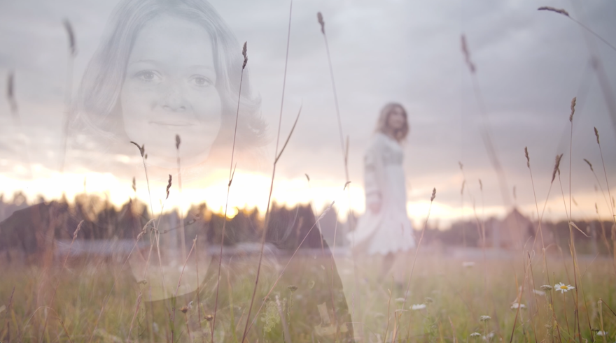 Composited image of a real photo of client, "Ruth" juxtaposed over stock footage of a woman in a field. Shows how we can merge images to create more feeling to express a scene in a life story video