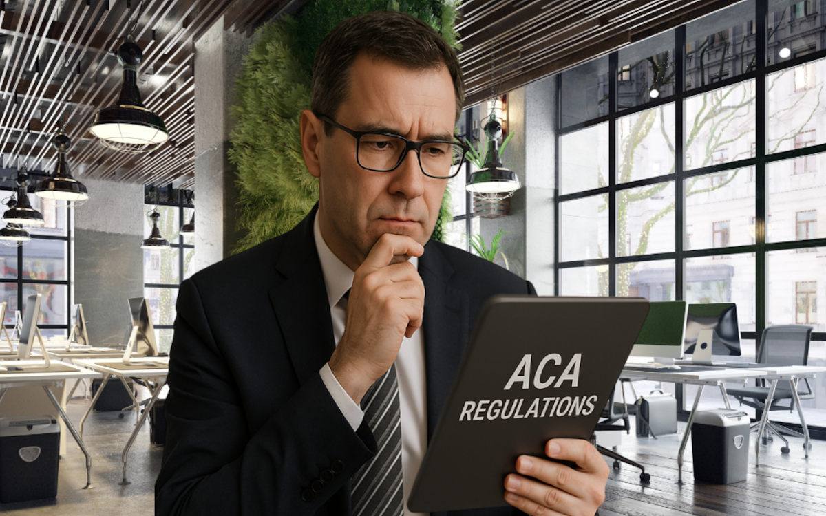 Business man examining ACA Regulations