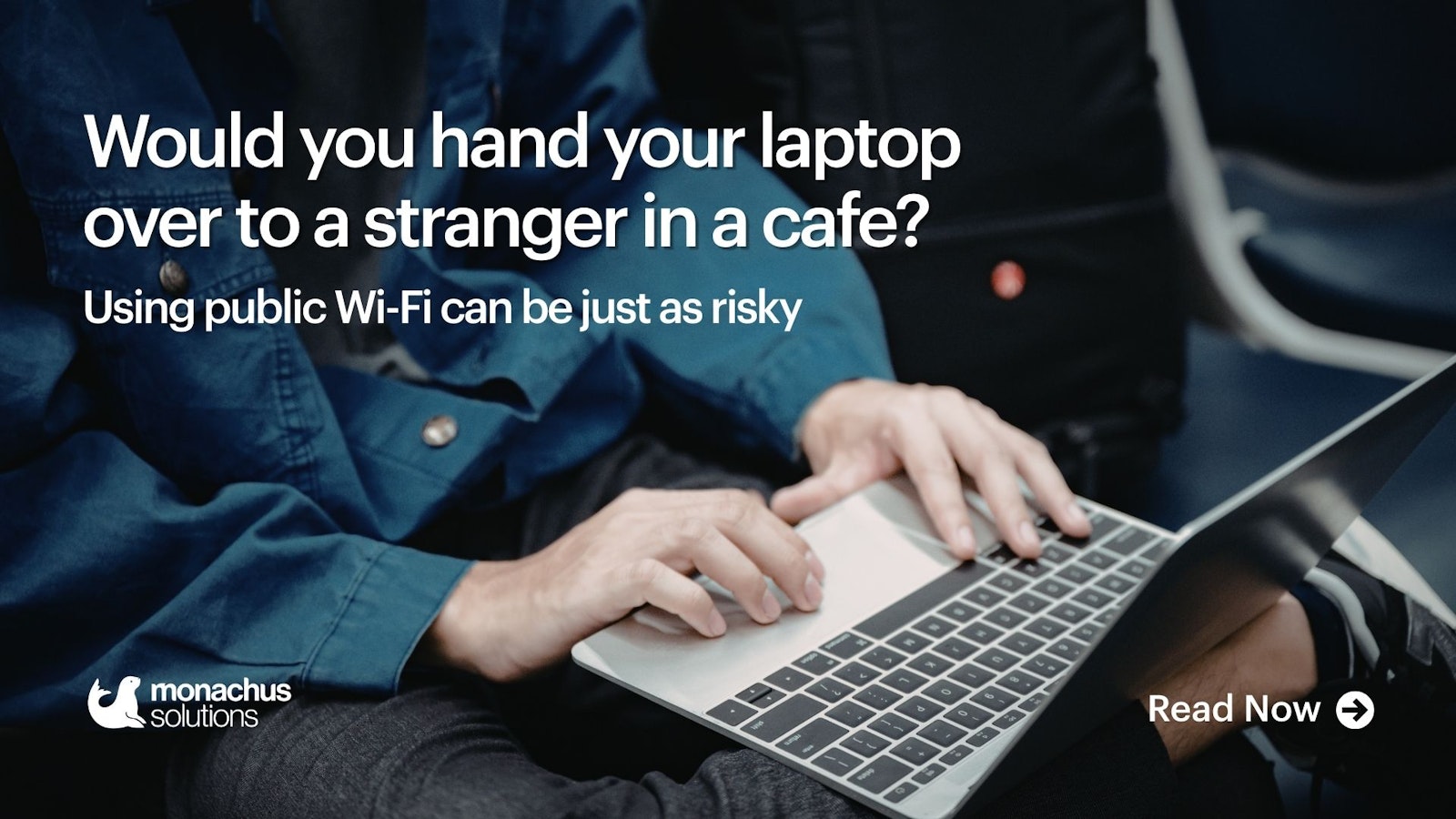 person in a cafe with laptop