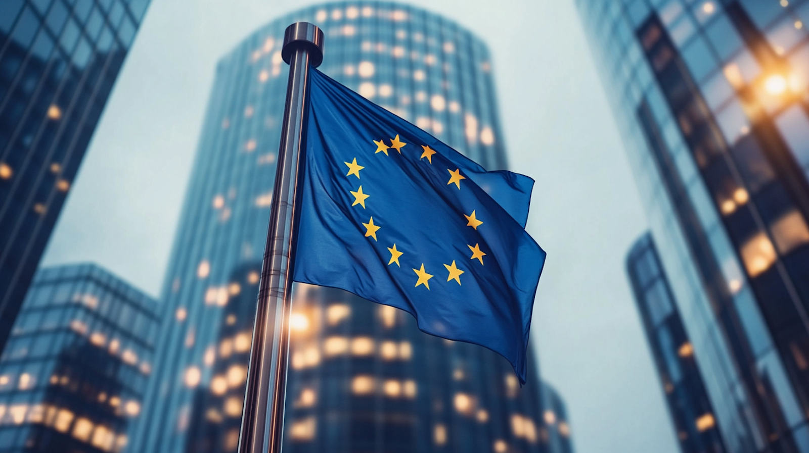 The European Union flag waving in front of modern office buildings, symbolizing JetHire's alignment with EU AI Act standards for ethical and transparent recruitment practices